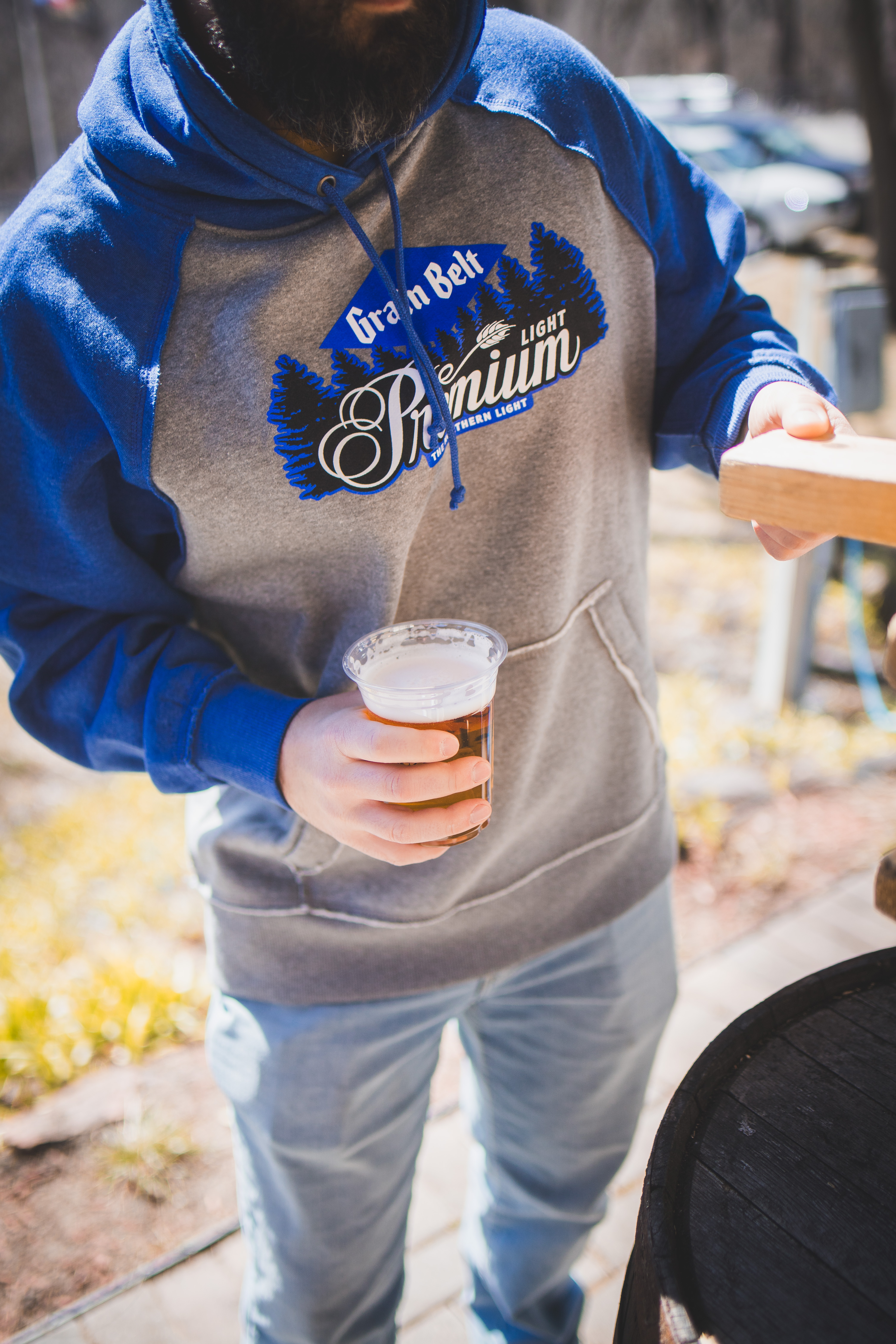 Grey sweatshirt with blue sleeves and the Grain Belt Premium Light logo on chest.