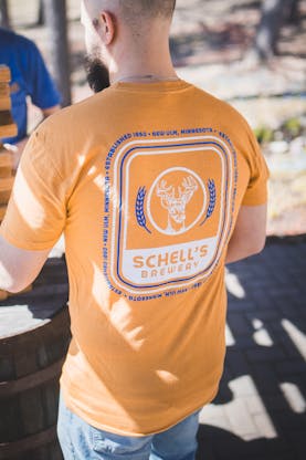 Yellow t-shirt with Schell logo on front and back.