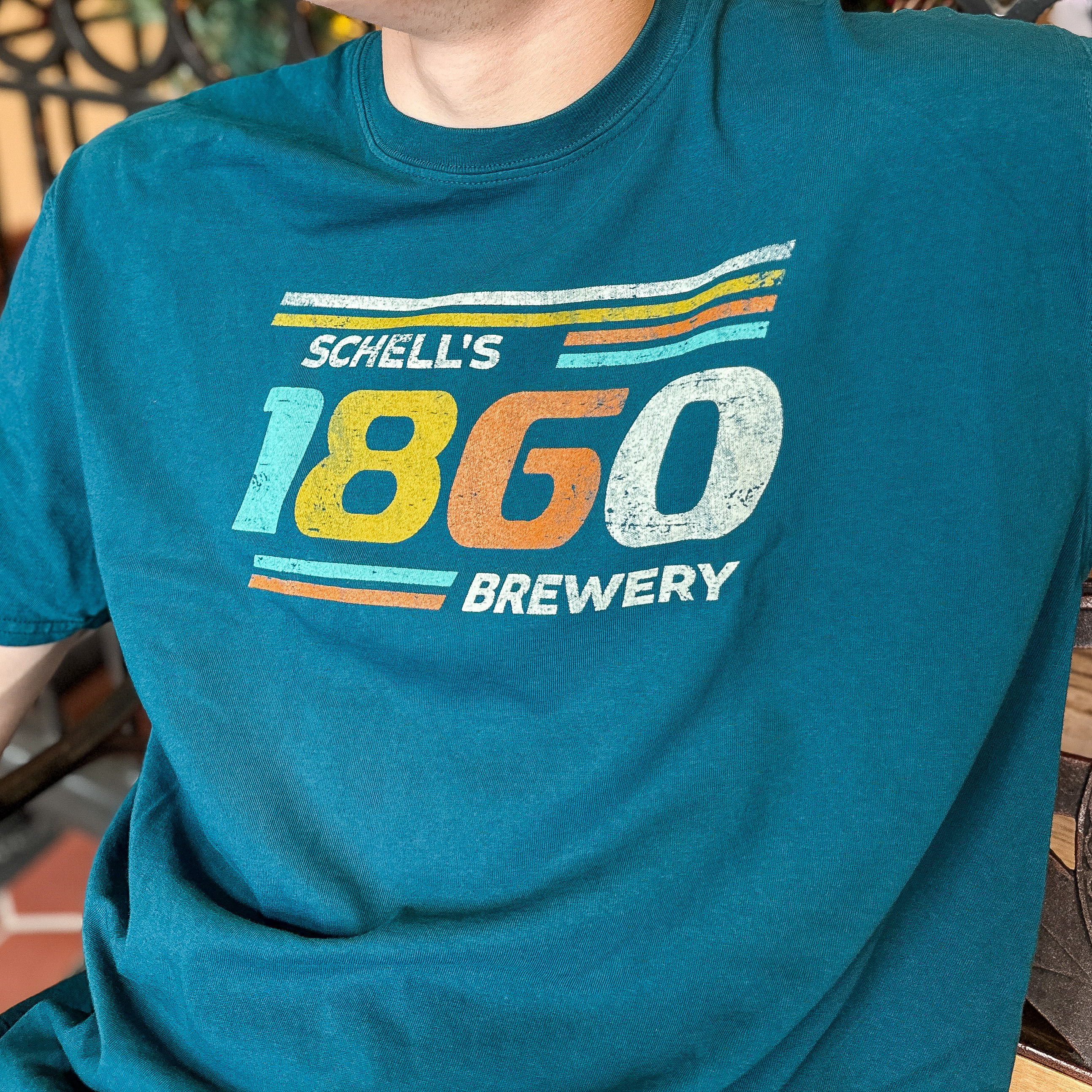 Aqua blue t-shirt with "Schells 1860" on front