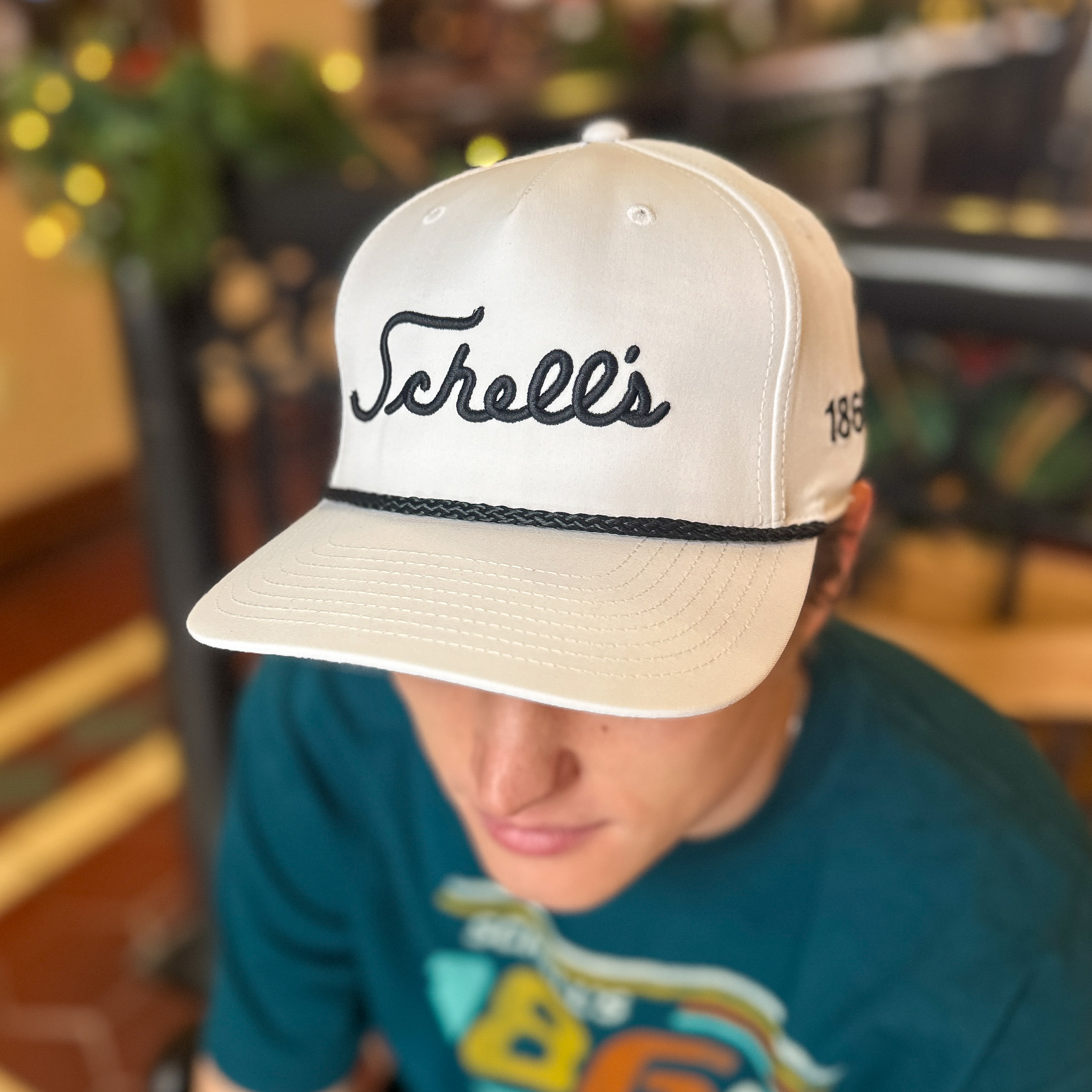 White hat with Schells on the front.