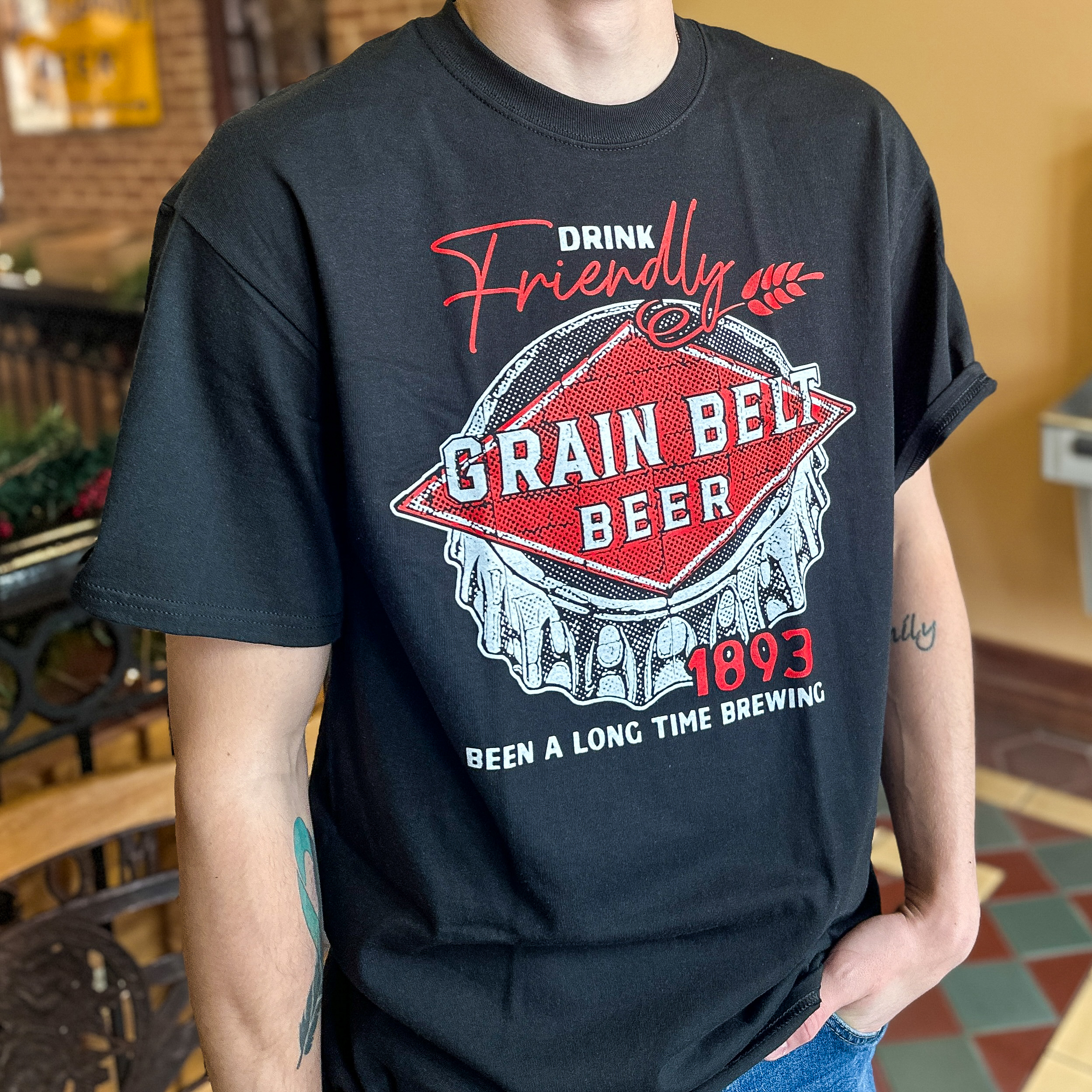 Black t-shirt with Grain Belt logo on front.