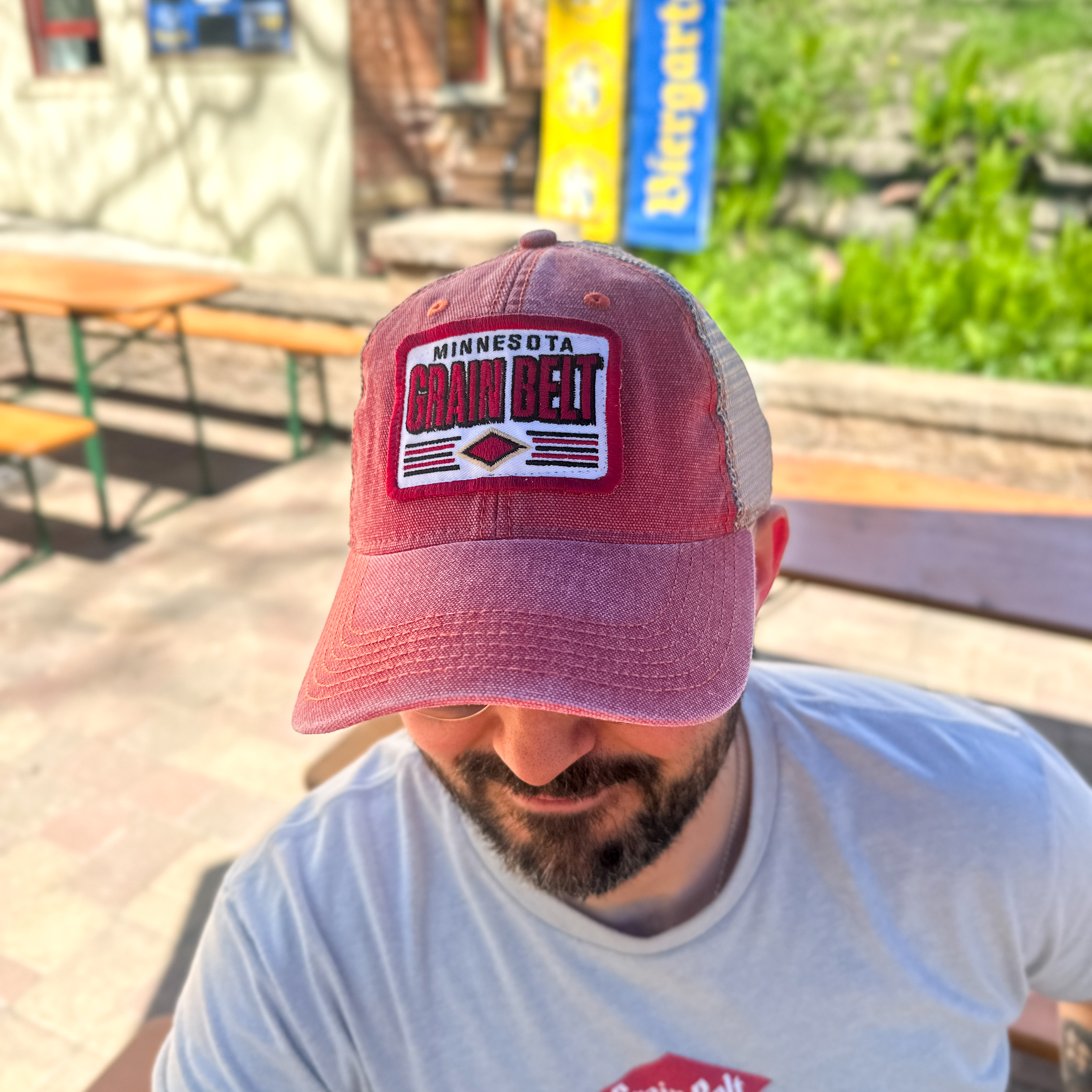 Red and grey baseball hat with Grain Belt patch on the front.