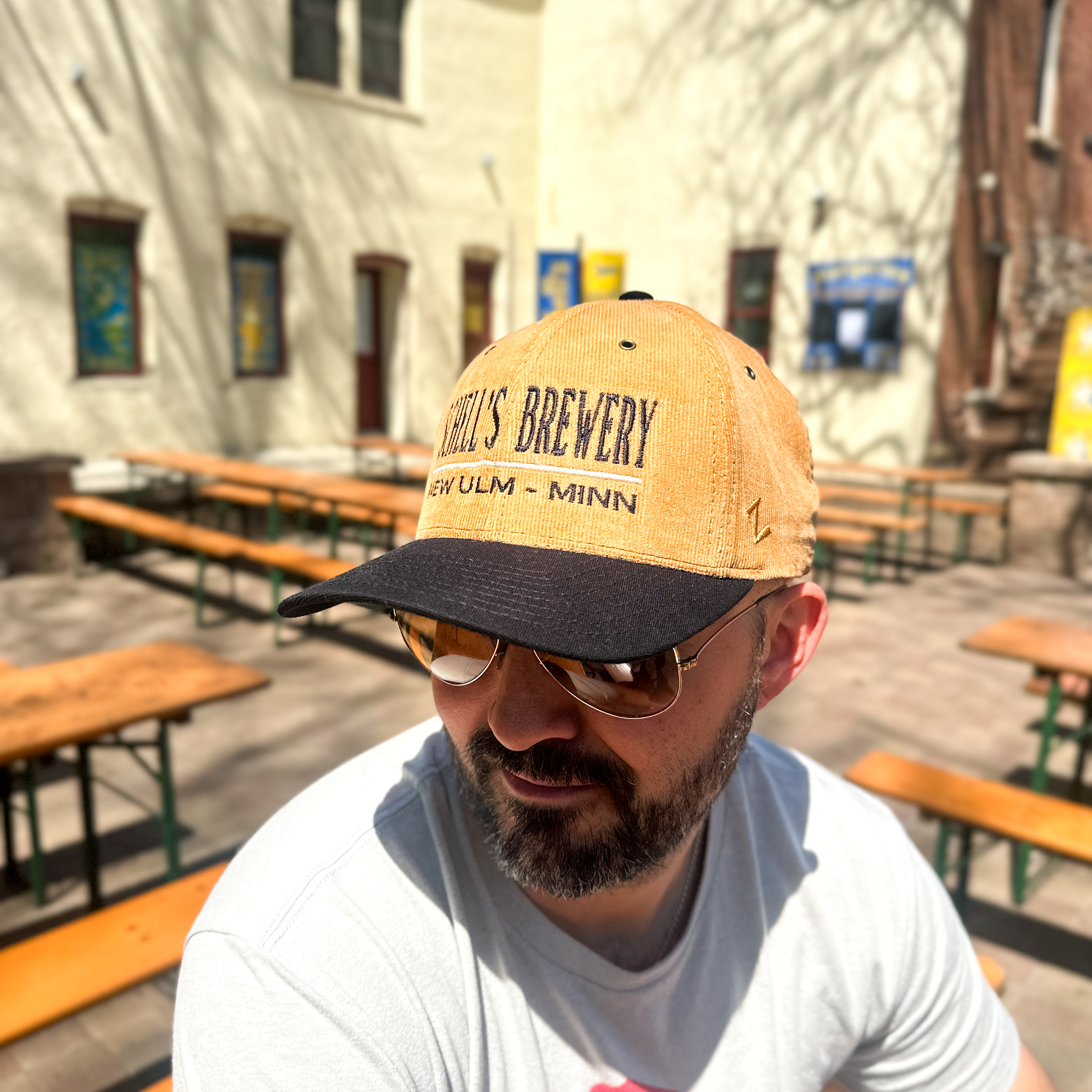 Tan and black corduroy baseball hat with Schells on the front.