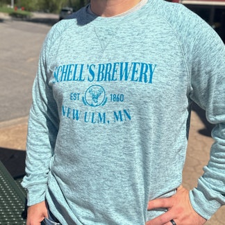 Aqua blue heather crew sweatshirt with Schell logo on the front.