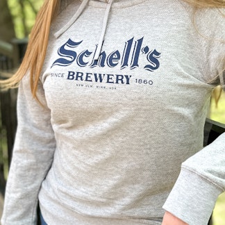 Heather grey sweatshirt with Schells logo on the front.