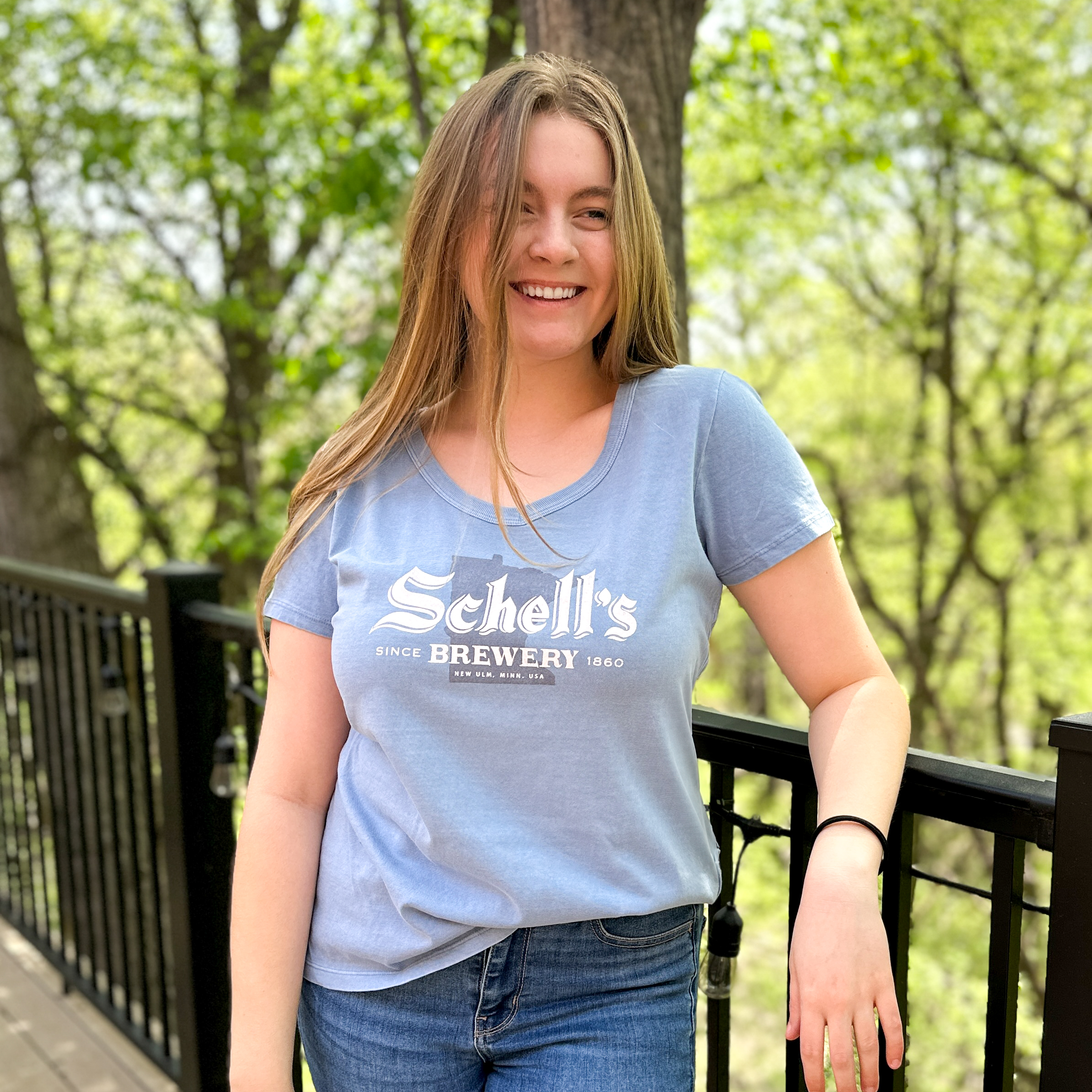 Dust blue colored tee with Schell logo on the front.