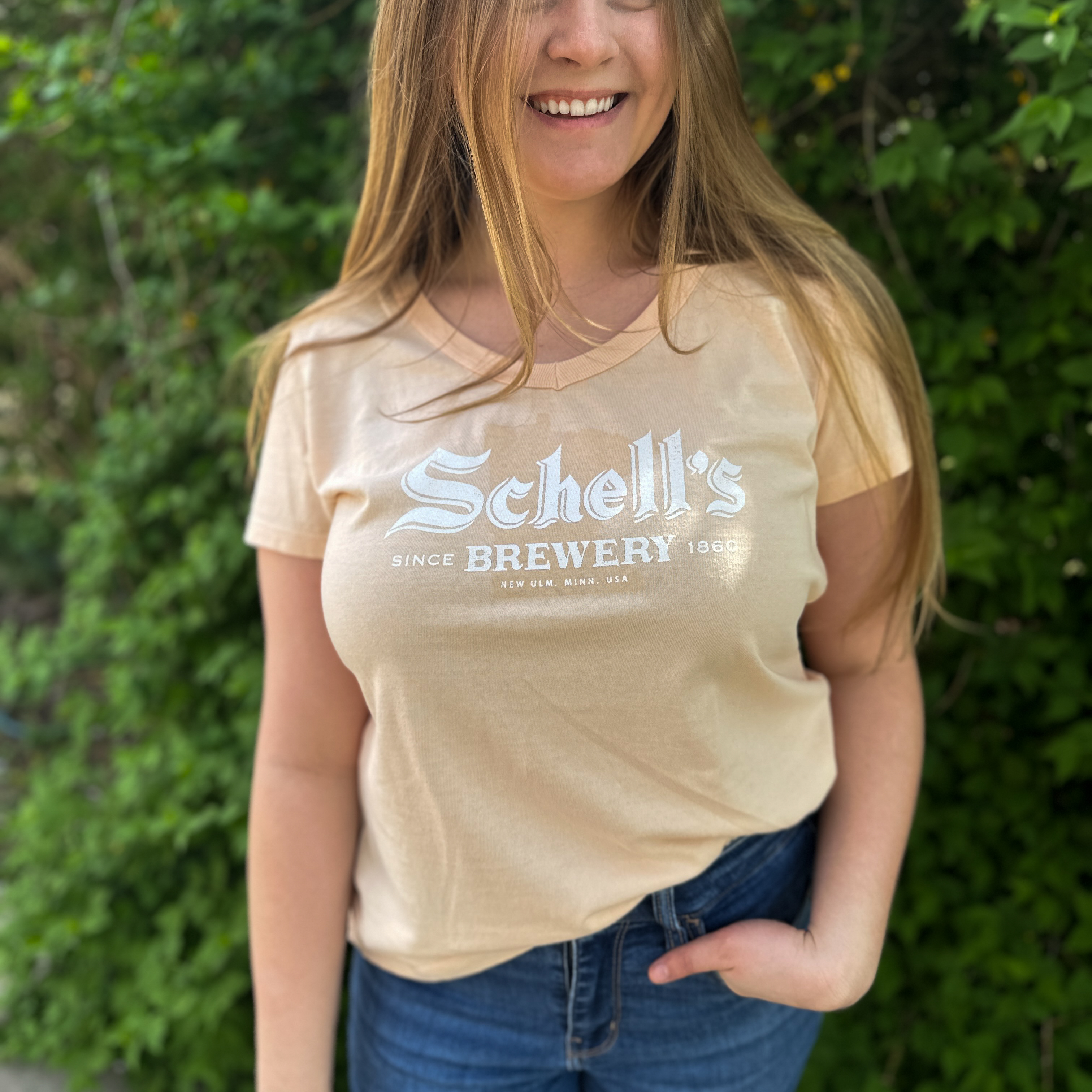 Melon yellow tee with Schell logo on the front.