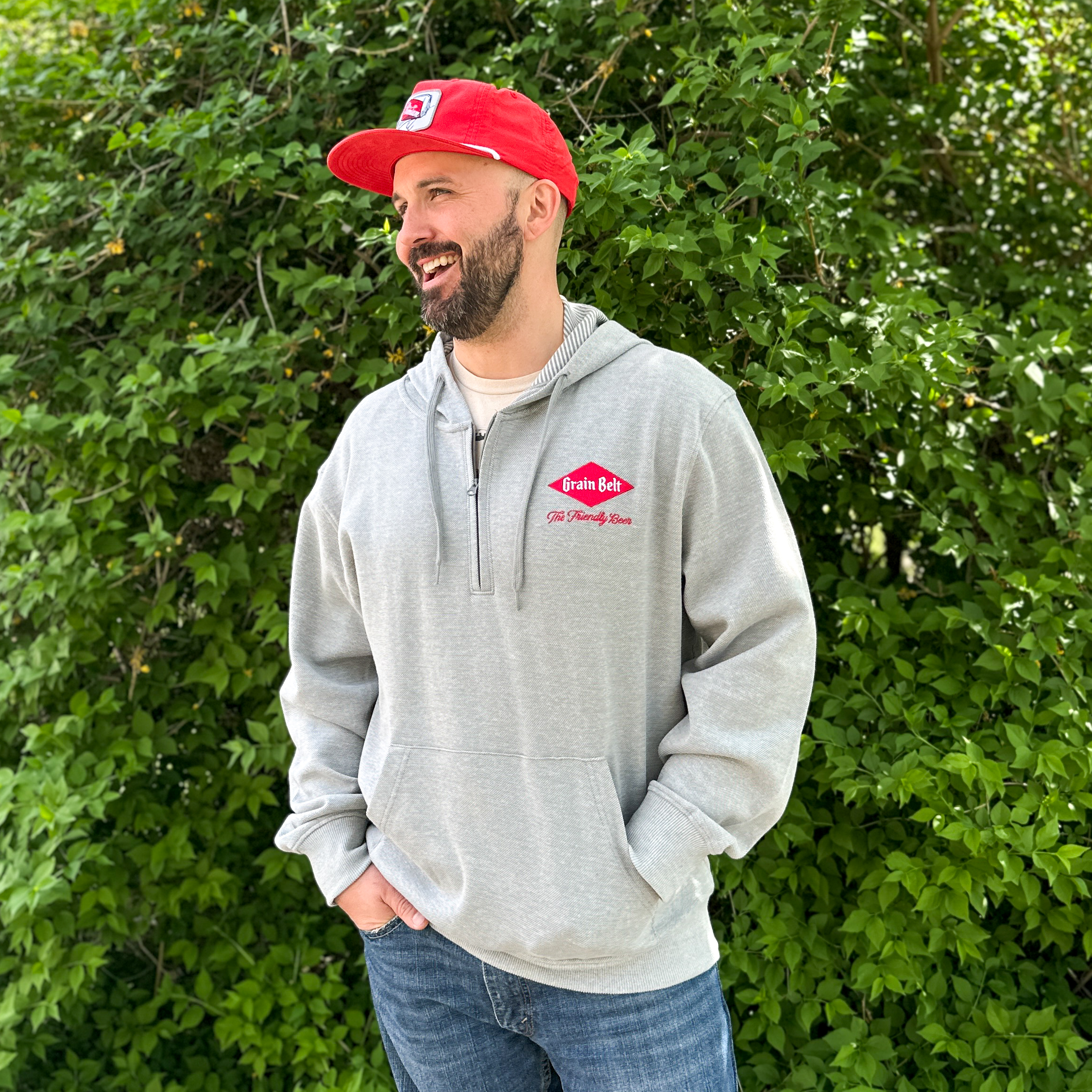 Grey hooded quarter zip sweatshirt with Grain Belt logo on left lapel.