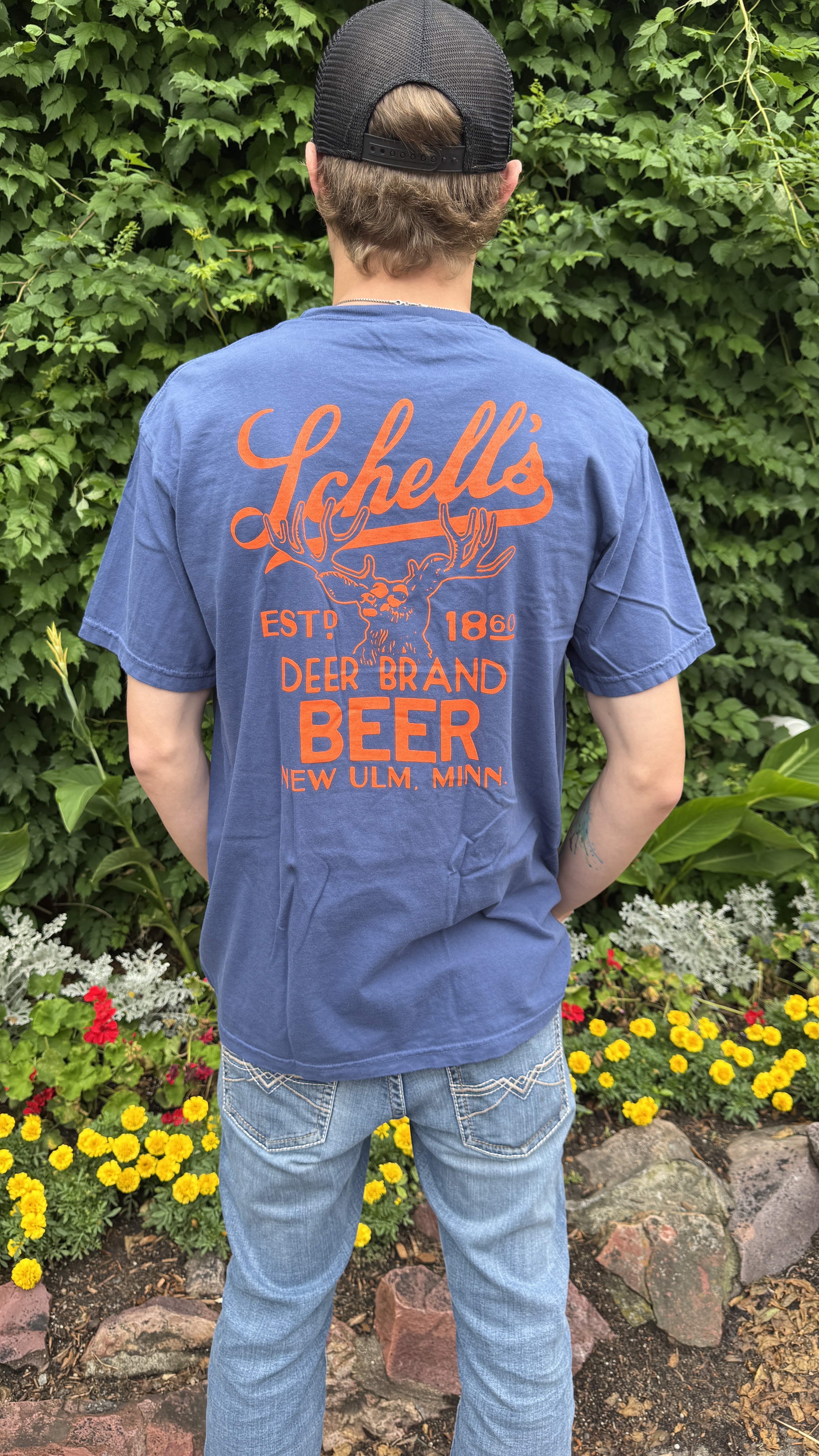 Navy blue t-shirt with Schell logo on the front and back.