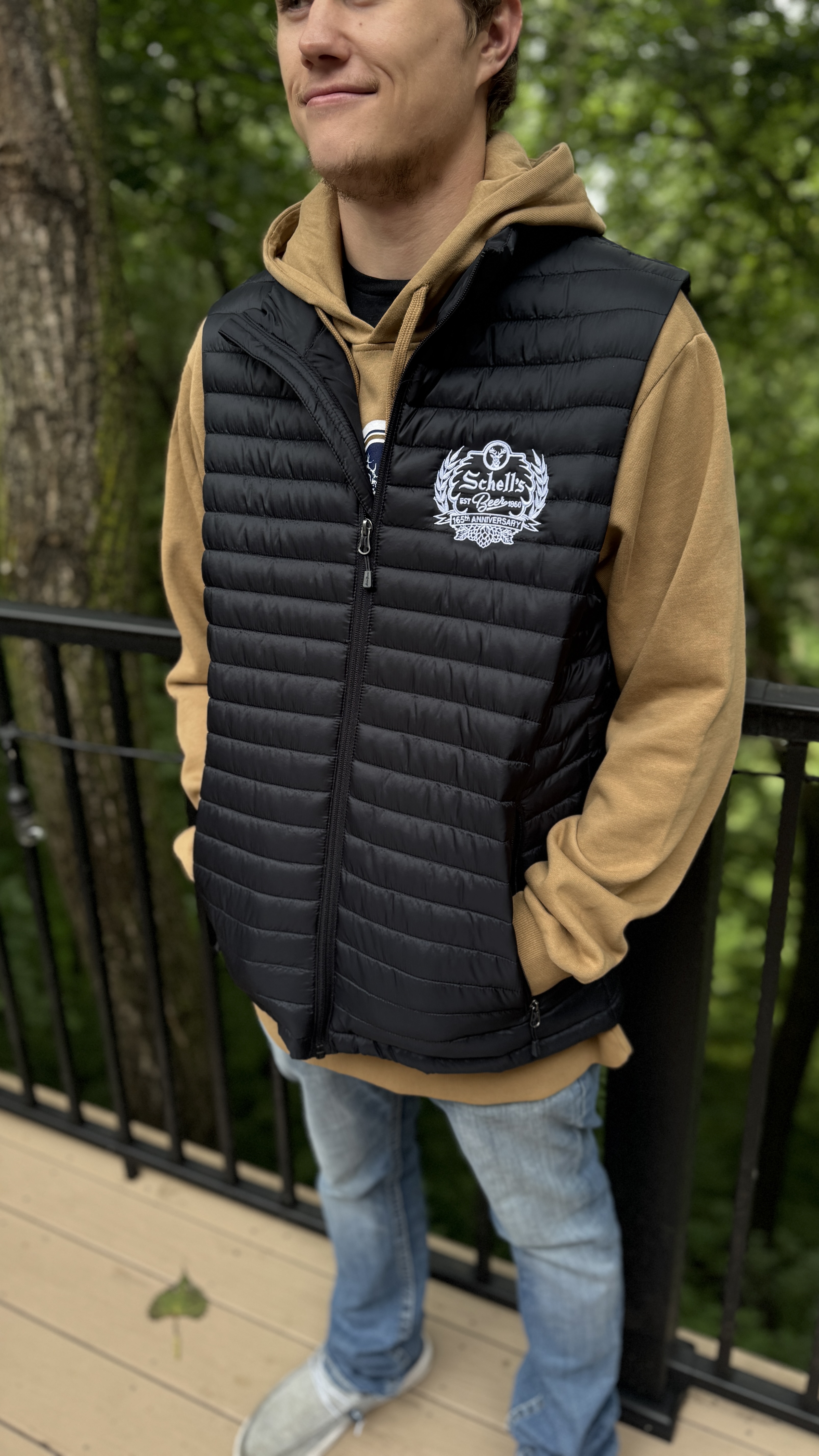 Black vest with Schell 165th anniversary logo embroidered on left lapel.