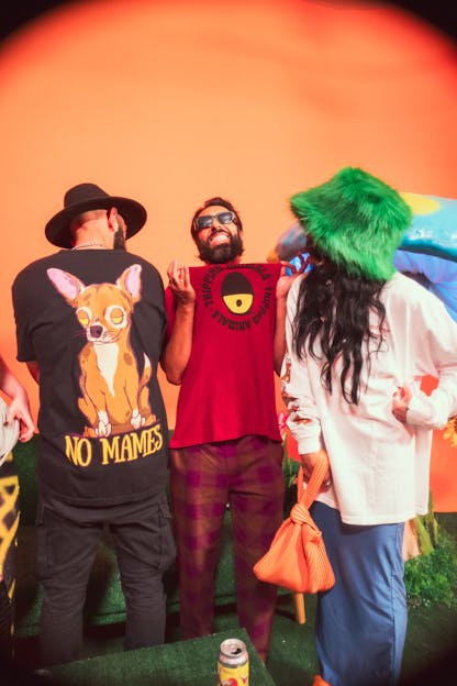 Group of people enjoying and wearing tripping animals brewing merch 