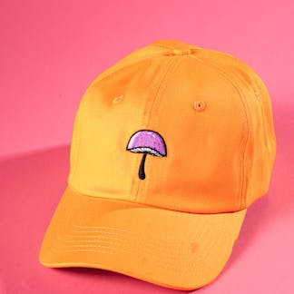 A yellow hat with a mushroom from tripping animals brewing 