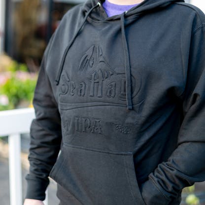 close-up image black on black embossed Sea Hag logo hoodie