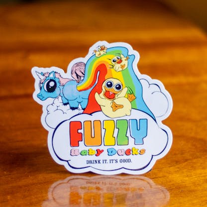 Close-up photo of Fuzzy Baby Ducks rainbow logo sticker