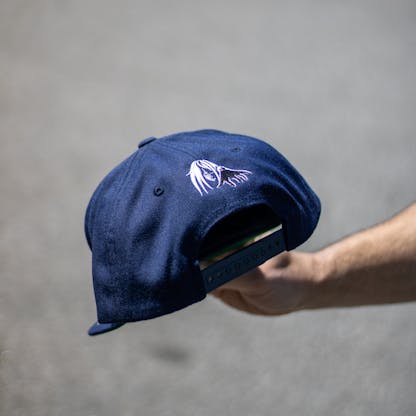 back view of navy hat with Sea Hag embroidered over opening