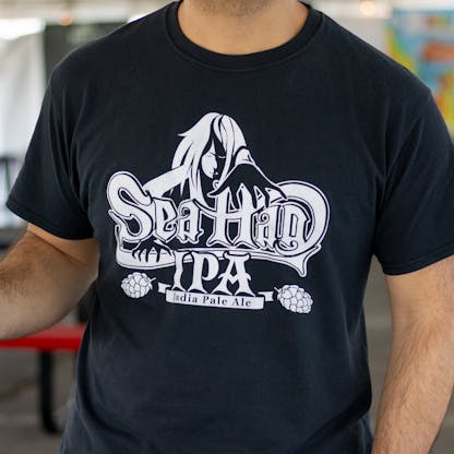 Close up of one color Sea Hag beer logo on black t-shirt
