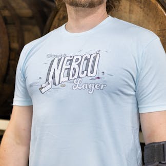 close up of blue NEBCO Lager logo t-shirt