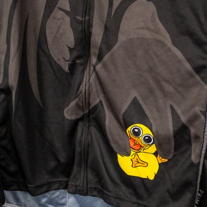 close-up of bike jersey with sea hag and fuzzy baby duck logo