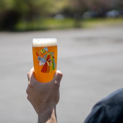 16 oz Fuzzy Pint glass being held outside