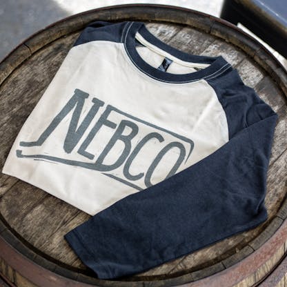 NEBCO state logo baseball T shirt folded on table