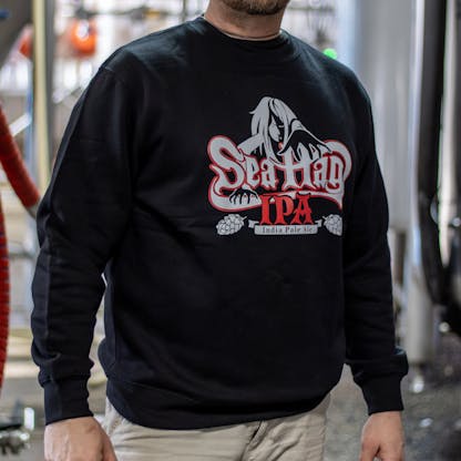 Close-up image of Sea Hag beer logo in 2 colors on crew neck sweatshirt