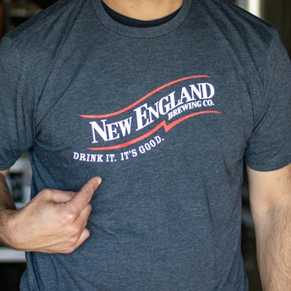 close up short sleeve gray t-shirt with New England Brewing Company swoosh logo