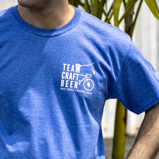 Close up of Team Craft Beer logo on left chest of blue t-shirt