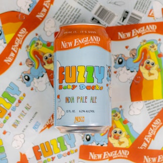 Can of Fuzzy Baby ducks over collage of labels