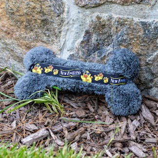 Bone-shaped dog toy with Fuzzy Baby Ducks branding