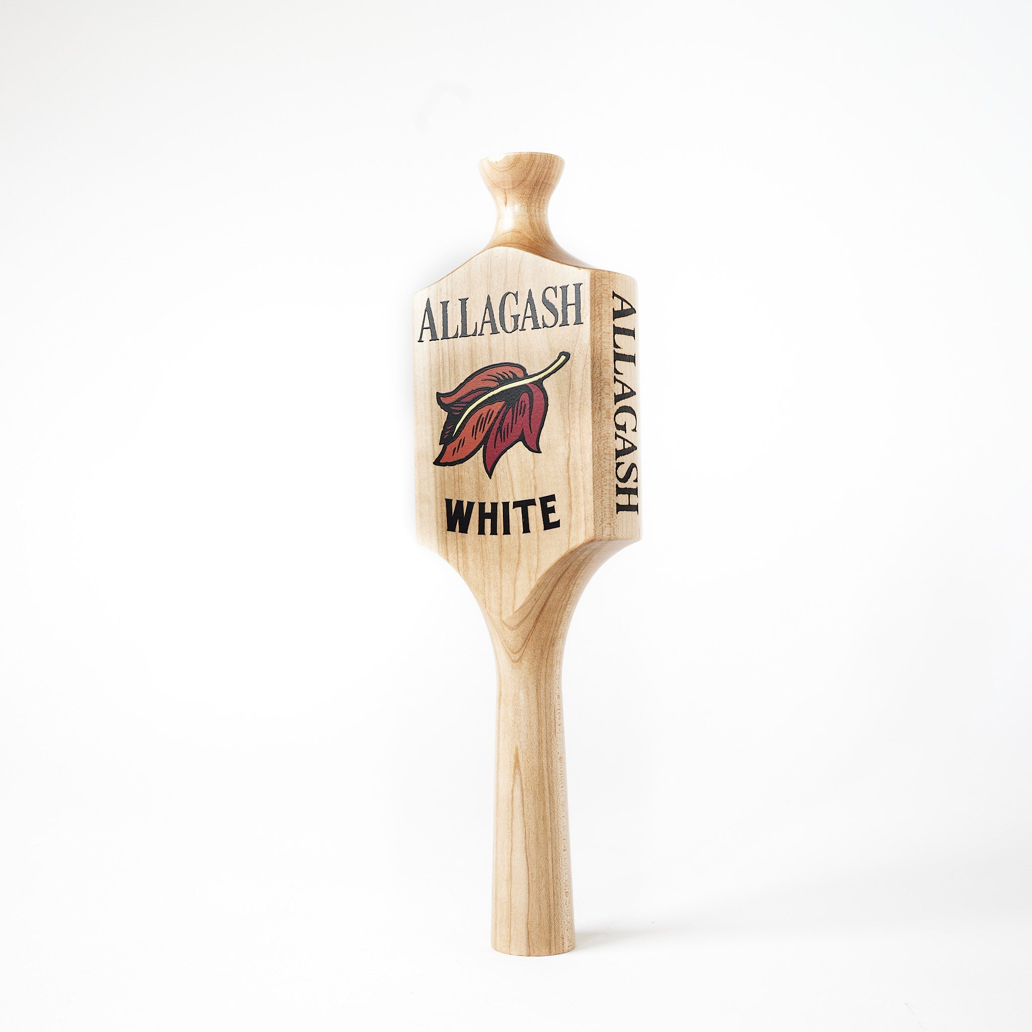 a wooden tap handle featuring a leaf logo and the text Allagash White