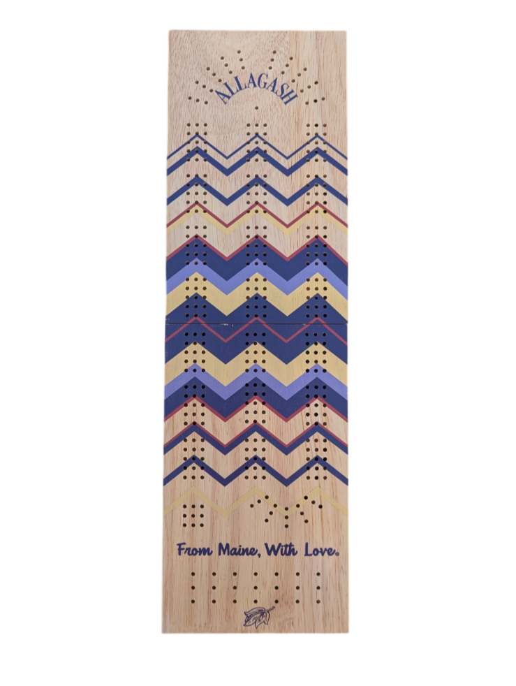 A wooden cribbage board with multicolor stripes