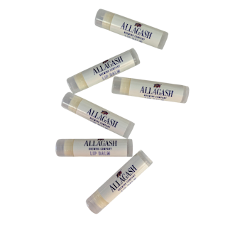 6 tubes of lip balm in white containers