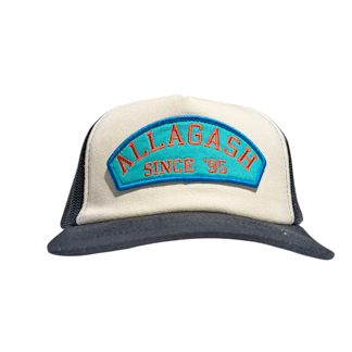 a white front trucker hat with an arched blue patch reading Allagash Since '95