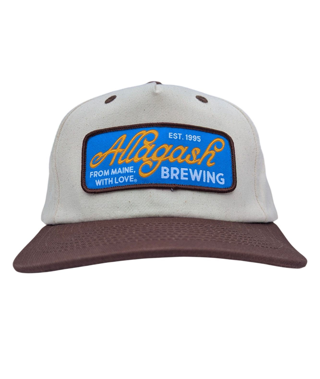 A white hat with brown brim and blue patch. The patch reads Allagash Brewery