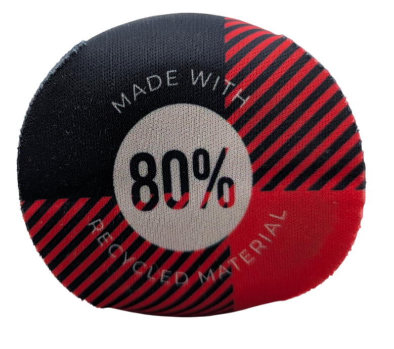 The bottom of a black and red check coozie with the text Made with 80% recycled material