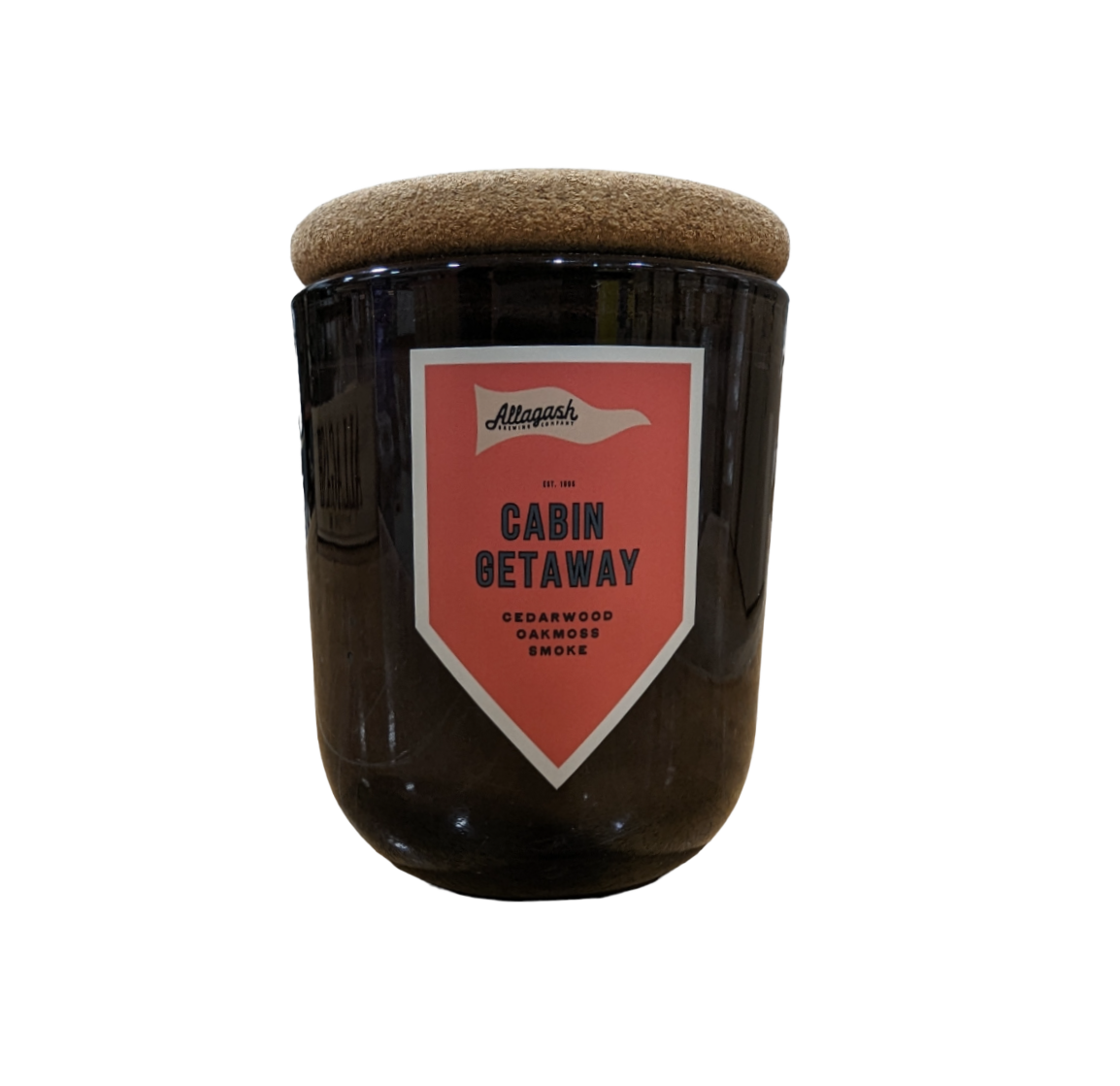 A glass jar candle with a label that reads "Cabin Getaway"