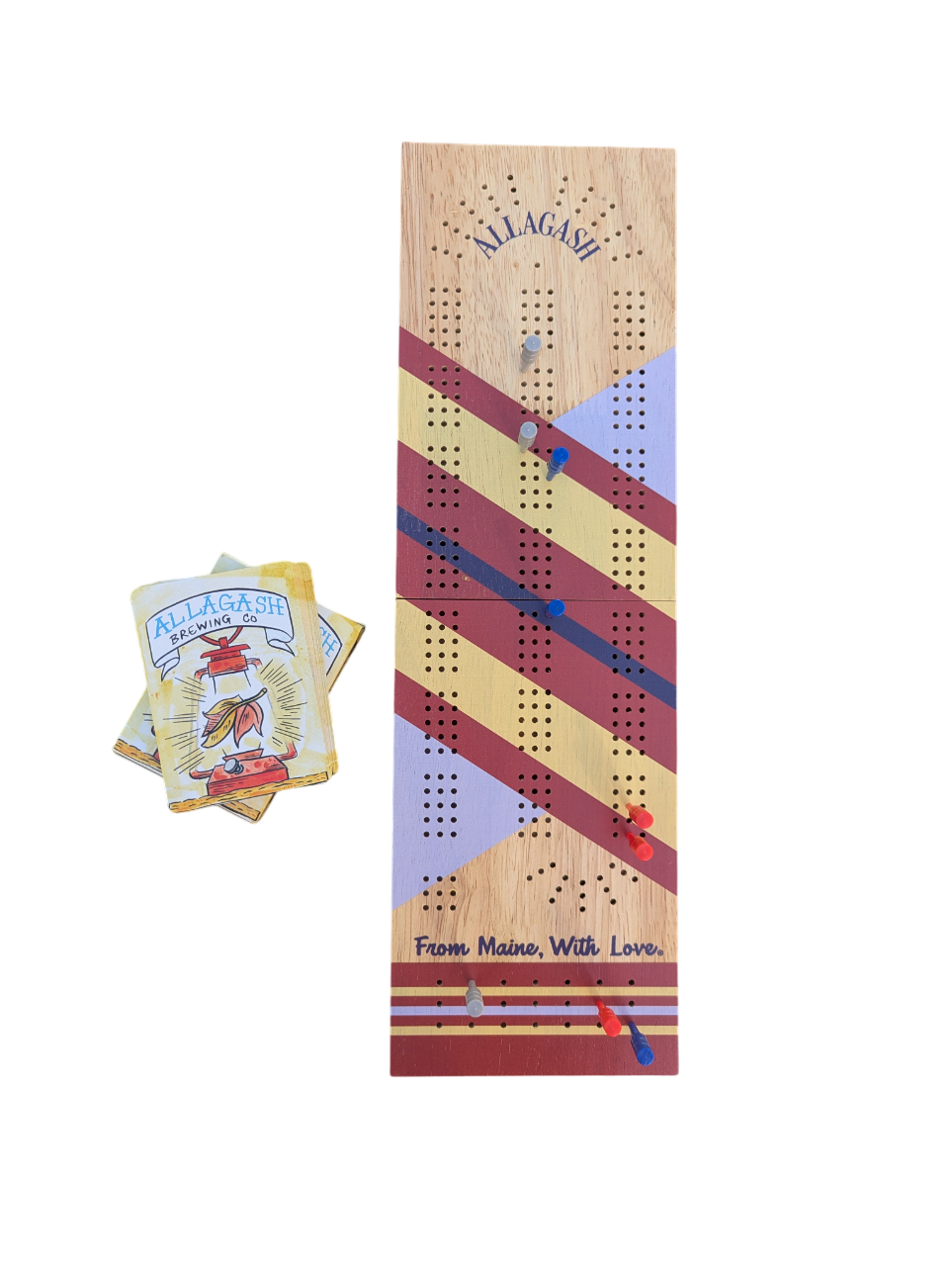 A colorfully striped cribbage board with a deck of cards
