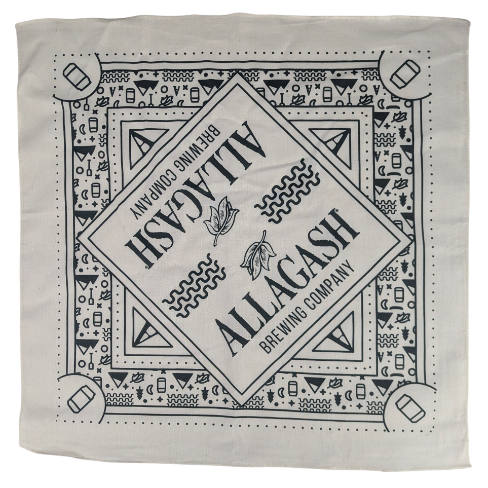 a cream color bandana with navy blue icons and the text Allagash Brewing Company