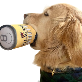 a dog holding a squeaky toy in its mouth