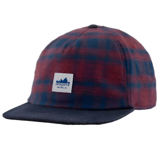 a red and blue checked hat with a patch that reads Patagonia