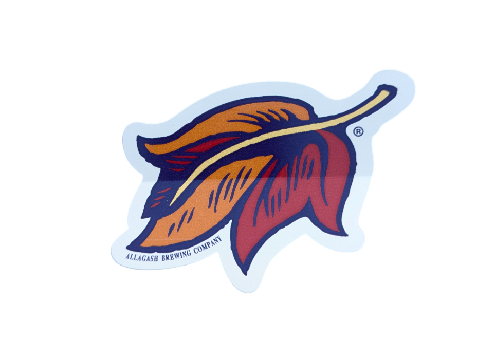 a red orange and yellow leaf sticker with the words Allagash brewing Company along the bottom