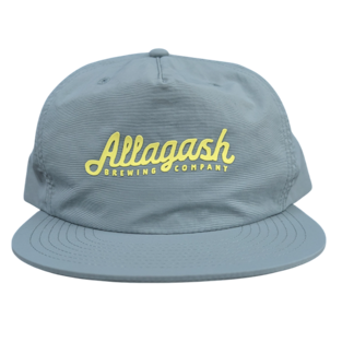 a blue hat with yellow text that reads Allagash Brewing Company
