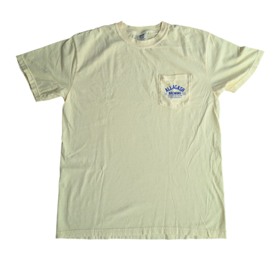 a yellow tee with text on the pocket that reads Allagash Brewing Company