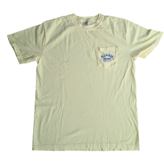 a yellow tee with text on the pocket that reads Allagash Brewing Company
