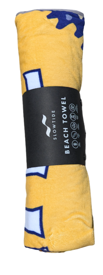 A rolled up beach towel with a black sleeve