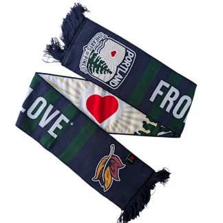 a scarf folded to show both sides. There is a heart in the middle and a portion of text that reads From Maine With Love