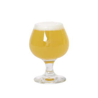 A full, small glass with a laser etched leaf on the front.