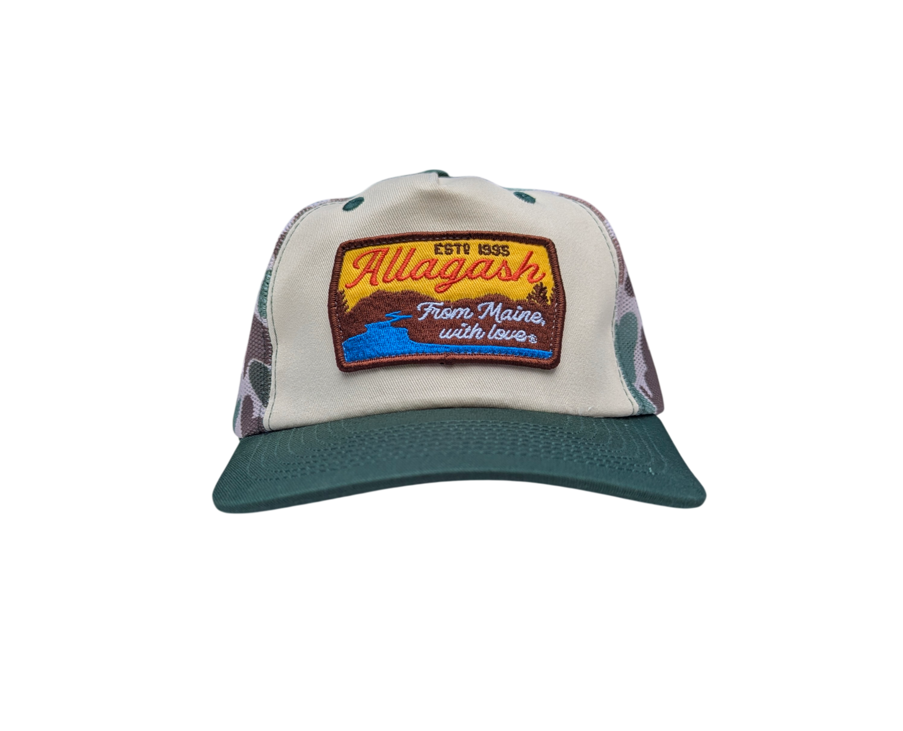 A trucker hat with a green bill, white front and a patch featuring a river scene