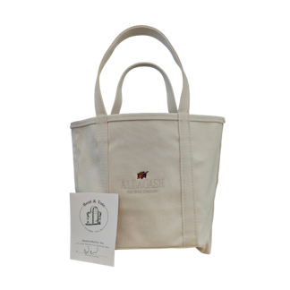A white totebag with a multicolor Allagash leaf and the text "Allagash Brewing Company"