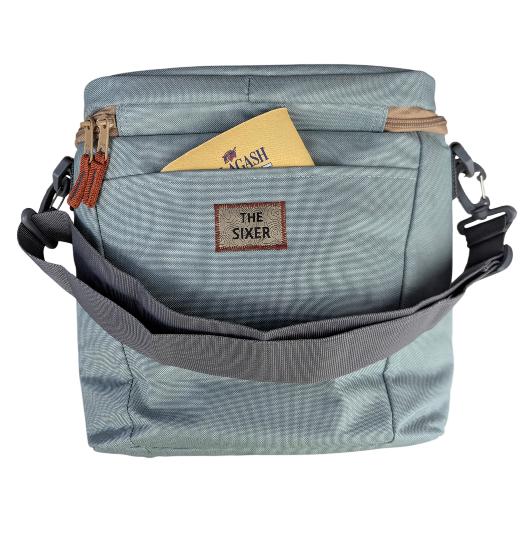 a cooler with shoulder strap and coozie sticking out of the pocket